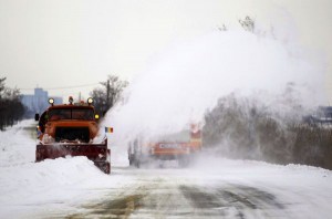 A utility vehicle clears the snow from the road near Urziceni